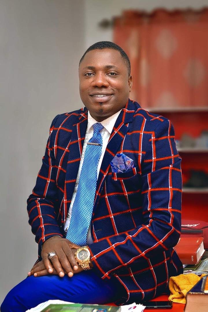 Bishop Godsevidence Pemu in a formal suit