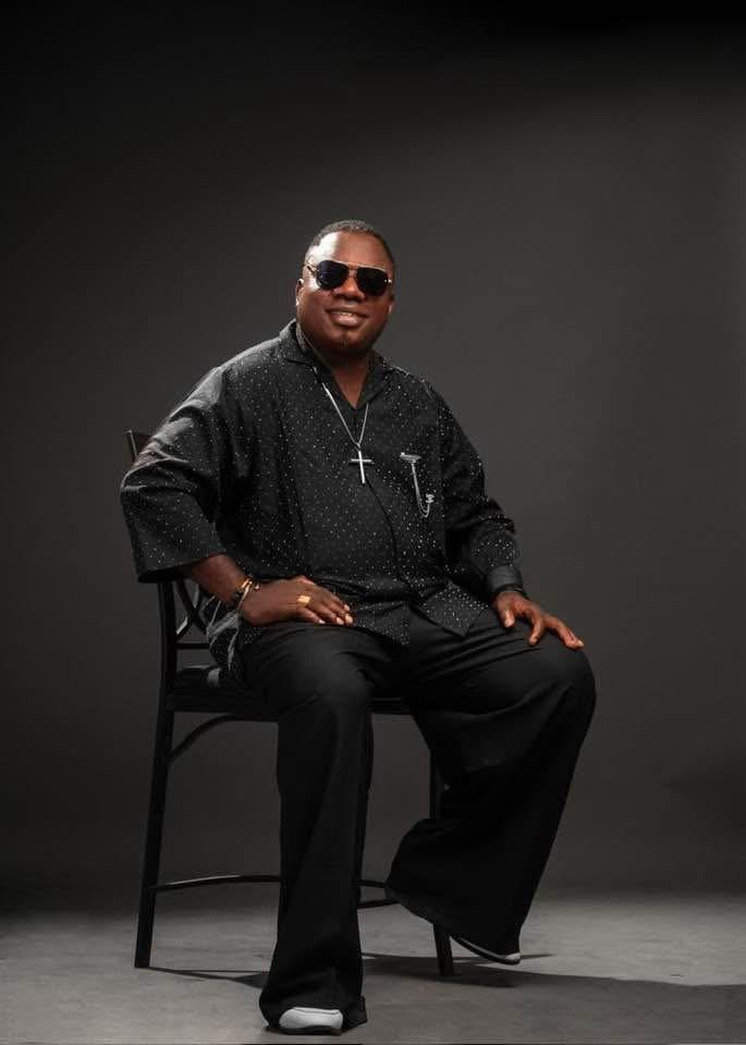 Bishop Pemu seated in a studio portrait